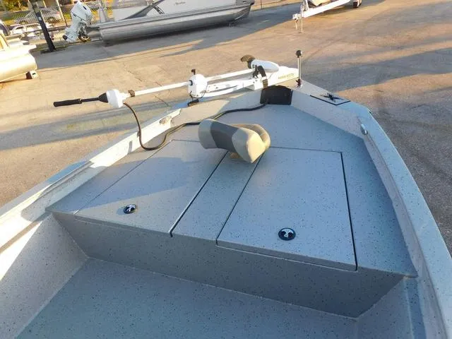 Slide: The Image of 2021 Xpress Boats H190 deck with storage compartments and trolling motor. - 5