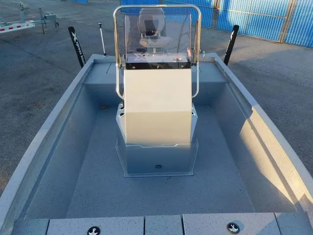 Slide: The Image of 2021 Xpress Boats H190 interior with center console and seating, parked on pavement. - 6