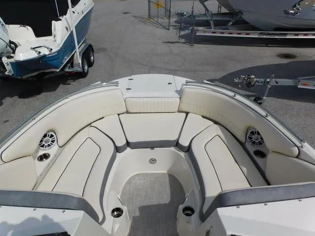 Slide: The Image of 2024 Stingray 231DC boat interior with spacious seating and cup holders. - 4