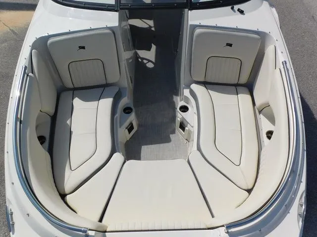 Slide: The Image of 2024 Stingray 231DC boat interior with spacious seating and cup holders. - 7