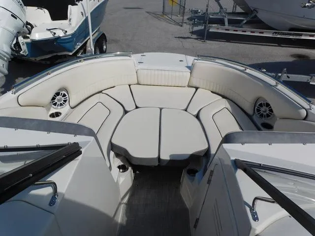 Slide: The Image of 2024 Stingray 231DC boat interior with cushioned seating and speakers. - 9
