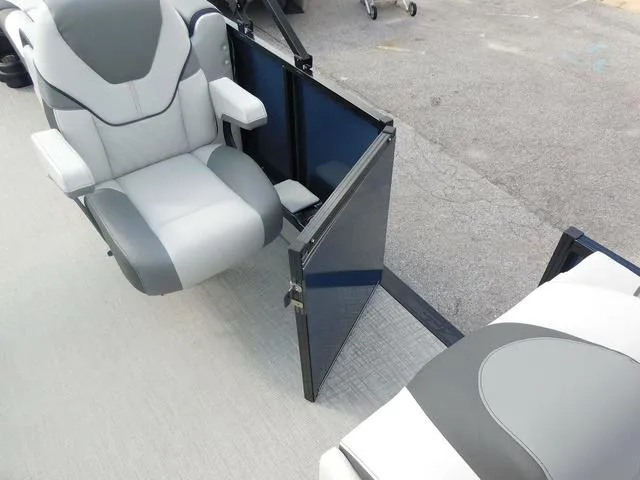 Slide: The Image of 2024 Avalon 2585 LSZ Quad Lounger interior with gray seating and open side gate. - 13