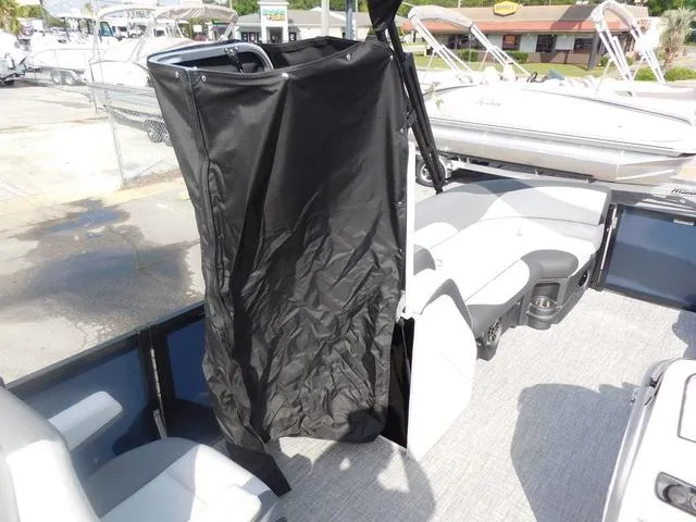 Slide: The Image of 2024 Avalon 2585 LSZ Quad Lounger interior with privacy curtain and seating. - 14