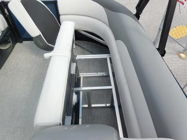 Slide: The Image of 2024 Avalon 2585 LSZ Quad Lounger interior with gray seating and storage space. - 15