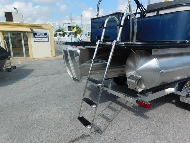 Slide: The Image of 2024 Avalon 2585 LSZ Quad Lounger pontoon boat with ladder and aluminum pontoons. - 7