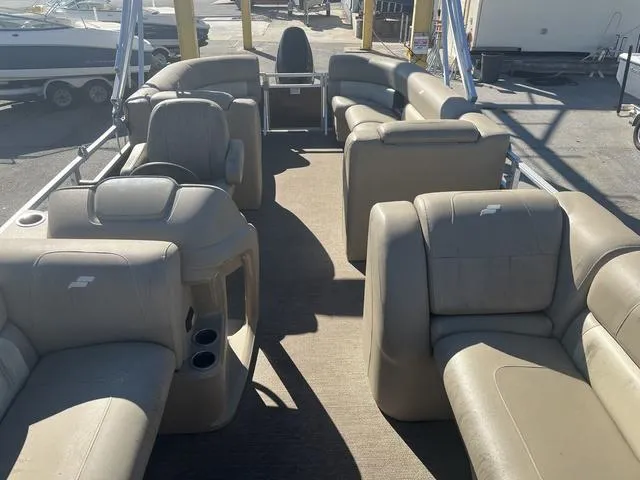 Slide: The Image of 2020 Starcraft LX 22 R pontoon boat with spacious seating and modern design. - 5