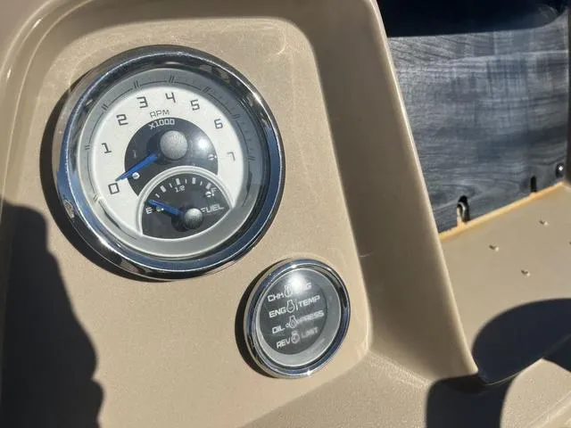Slide: The Image of Dashboard of 2020 Starcraft LX 22 R boat with RPM and fuel gauges. - 8