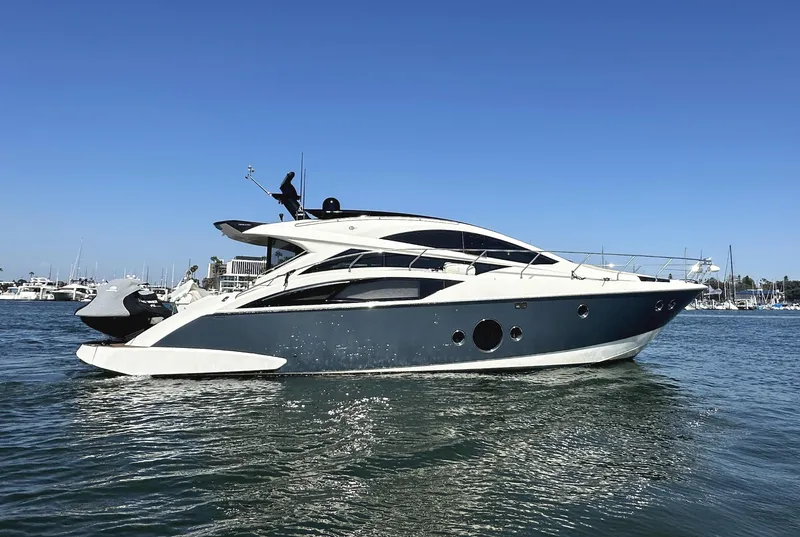 The Image of 2011 Marquis Sport Coupe yacht cruising on a sunny day. - 0