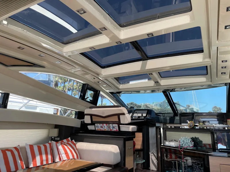 Slide: The Image of Luxurious interior of a 2011 Marquis Sport Coupe yacht with modern seating and skylights. - 12