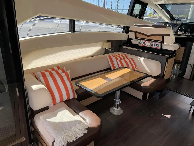 Slide: The Image of Luxury bar cabinet with glassware and bottles on a 2011 Marquis Sport Coupe yacht. - 16