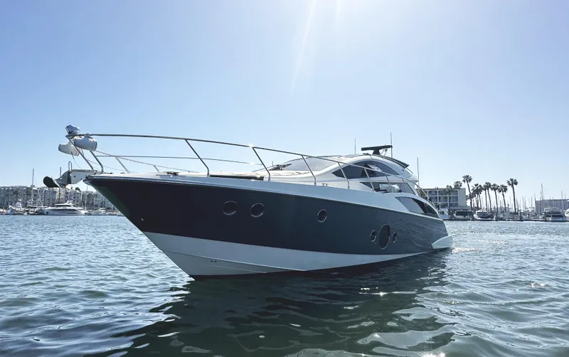 Slide: The Image of Luxury 2011 Marquis Sport Coupe yacht cruising on a sunny day. - 3