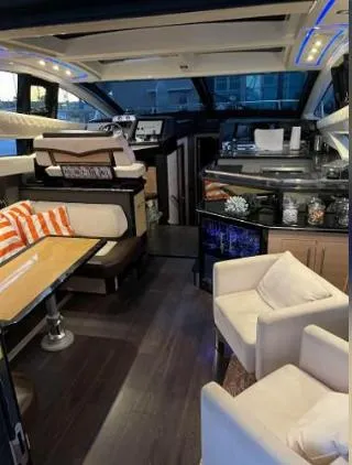 Slide: The Image of 2011 Marquis Sport Coupe cruising on a calm, scenic waterway under a clear blue sky. - 9