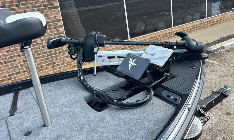 Slide: The Image of 2025 Phoenix 721 ZXL boat deck with Garmin equipment and trolling motor. - 2