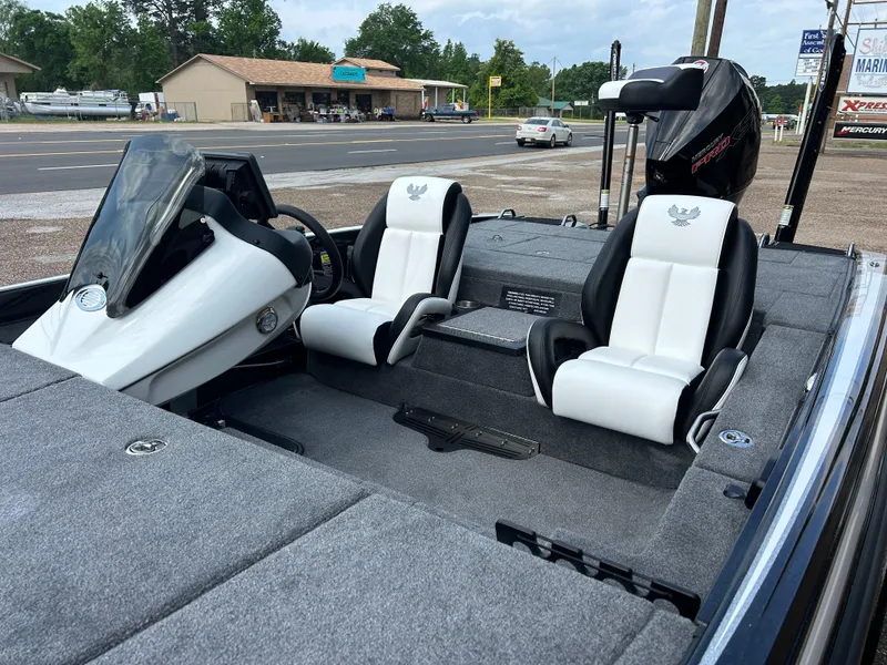 Slide: The Image of 2025 Phoenix 721 ZXL boat interior with dual seats and steering console. - 5