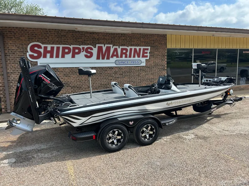 Slide: The Image of 2025 Phoenix 721 ZXL boat at Shipp's Marine dealership, parked on a trailer. - 6
