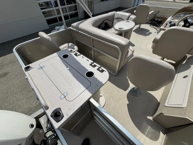 Slide: The Image of 2014 Sylvan Mirage Fish 8520 CNF pontoon boat interior with seating and table. - 11
