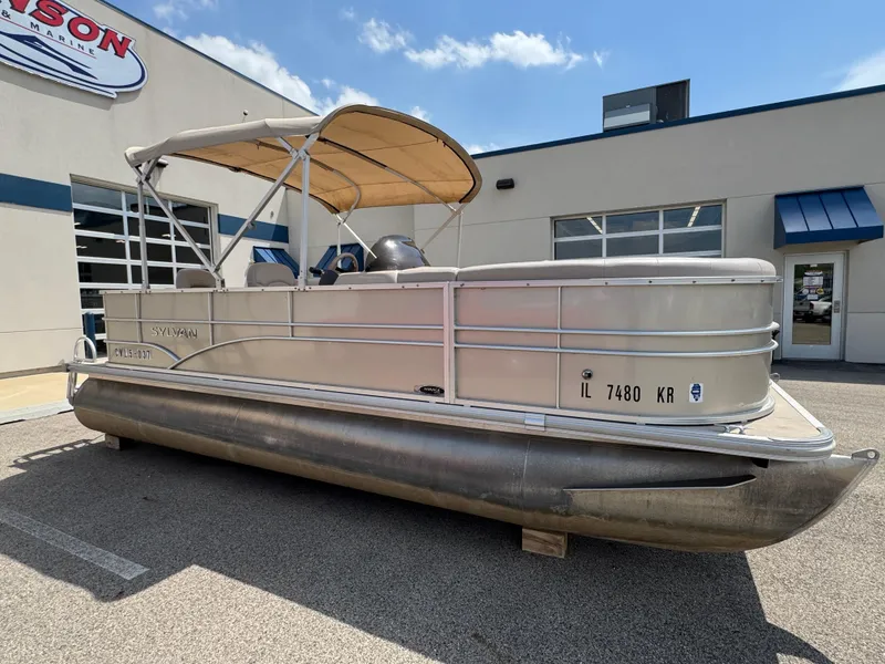 Slide: The Image of 2014 Sylvan Mirage Fish 8520 CNF pontoon boat parked outside dealership. - 5