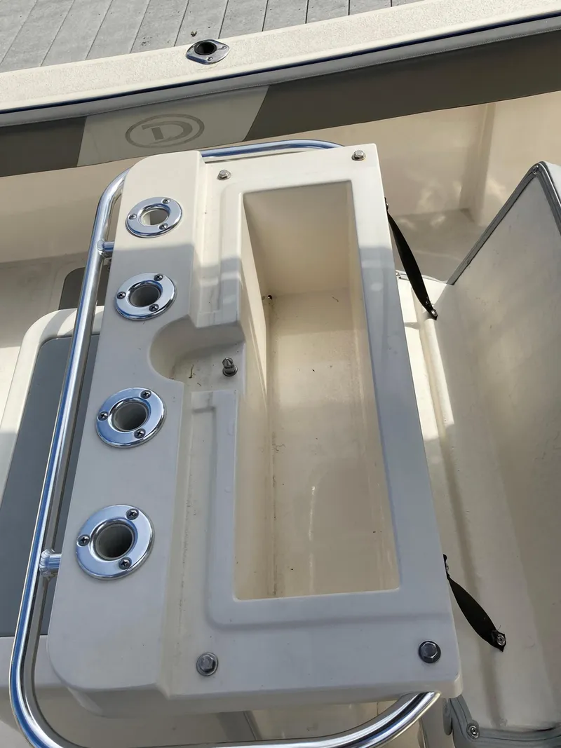 Slide: The Image of 2022 Defiance Commander boat with rod holders and storage compartment. - 10