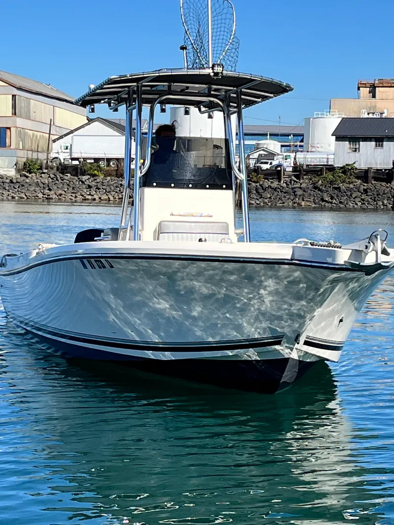 Slide: The Image of 2022 Defiance Commander boat on water, featuring sleek design and modern structure. - 19