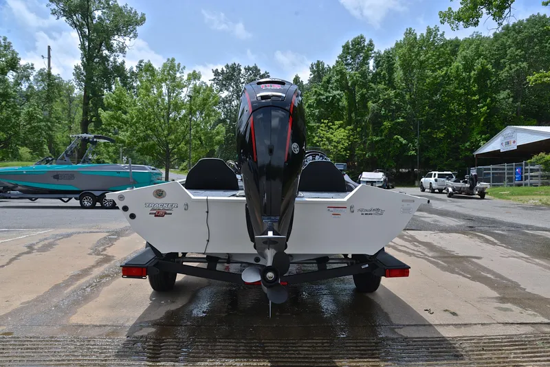Slide: The Image of 2023 Bass Tracker Pro Team 195 TXE boat on trailer, rear view, outdoors. - 13
