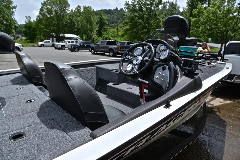 Slide: The Image of 2023 Bass Tracker Pro Team 195 TXE boat interior with steering console and seating. - 19
