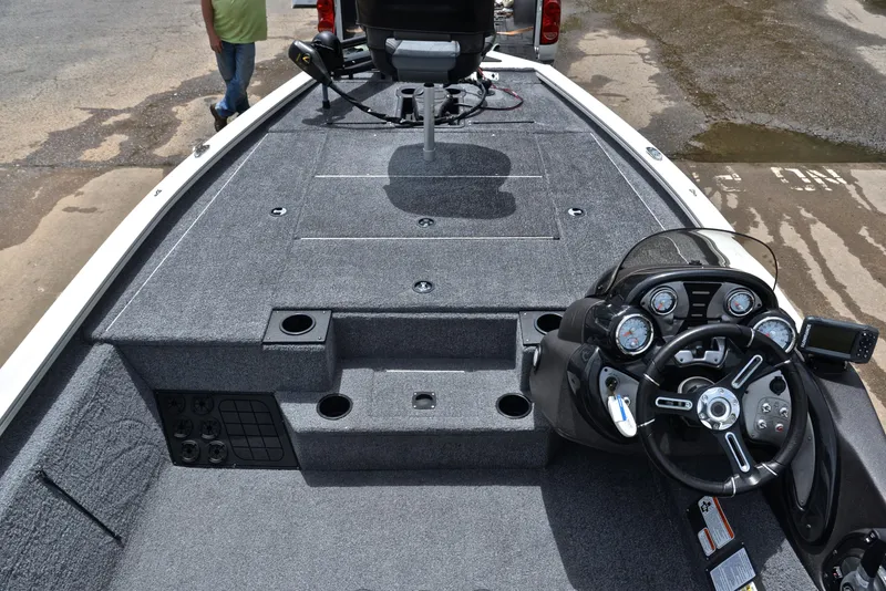 Slide: The Image of 2023 Bass Tracker Pro Team 195 TXE boat interior with steering console and seating area. - 20