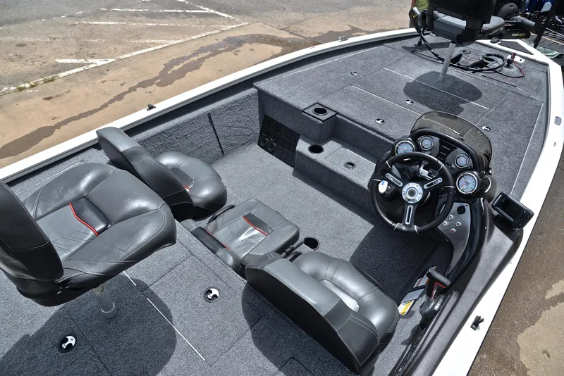 Slide: The Image of 2023 Bass Tracker Pro Team 195 TXE boat interior with steering console and seating. - 21