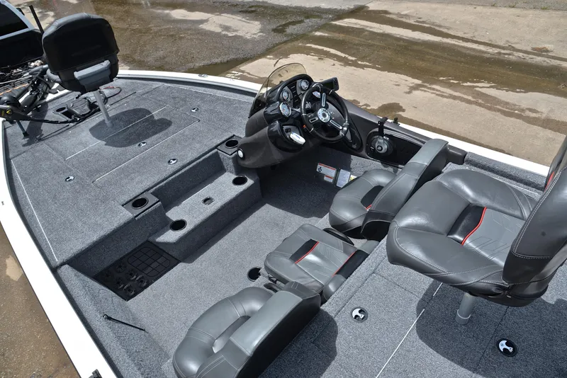 Slide: The Image of 2023 Bass Tracker Pro Team 195 TXE boat interior with seating and steering console. - 22
