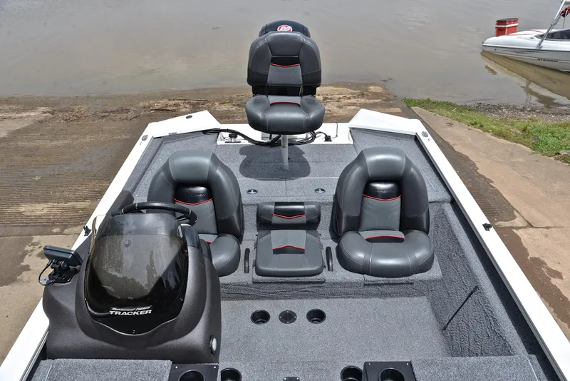 Slide: The Image of 2023 Bass Tracker Pro Team 195 TXE boat interior with seating and console. - 23