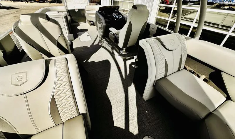 Slide: The Image of 2025 Godfrey Monaco Sundeck 235 SD interior with luxurious seating and modern design. - 11