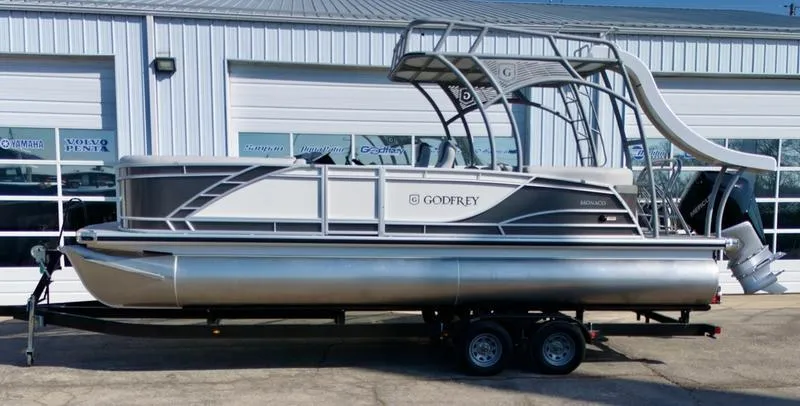 Slide: The Image of 2025 Godfrey Monaco Sundeck 235 SD pontoon boat with slide, parked on trailer. - 13