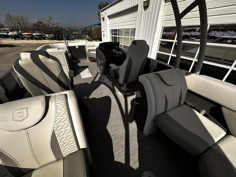 Slide: The Image of 2025 Godfrey Monaco Sundeck 235 SD interior with luxurious seating and modern design. - 18