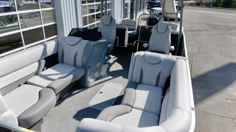 Slide: The Image of 2025 Godfrey Monaco Sundeck 235 SD boat interior with luxurious seating and modern design. - 6