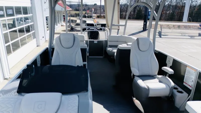 Slide: The Image of 2025 Godfrey Monaco Sundeck 235 SD interior with luxurious seating and modern design. - 7