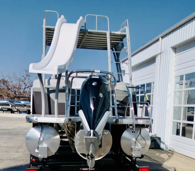 Slide: The Image of 2025 Godfrey Monaco Sundeck 235 SD with slide, parked outside a building. - 8