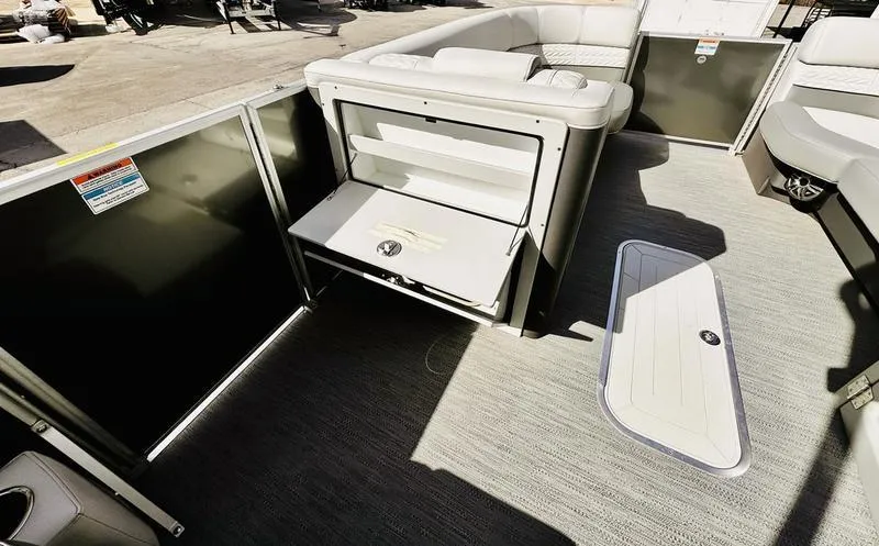 Slide: The Image of 2025 Godfrey Monaco Sundeck 235 SD interior with seating and storage compartments. - 9