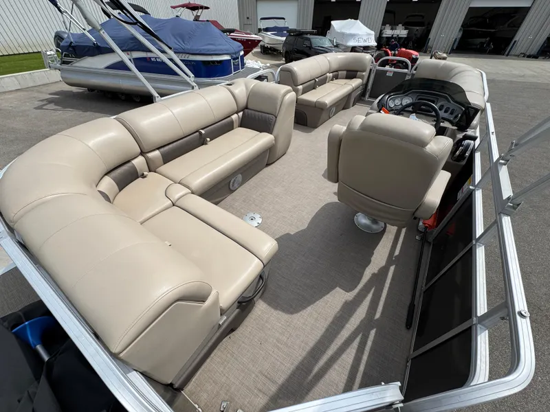Slide: The Image of 2021 Sun Tracker Party Barge 20 DLX pontoon boat with beige seating and spacious interior. - 5