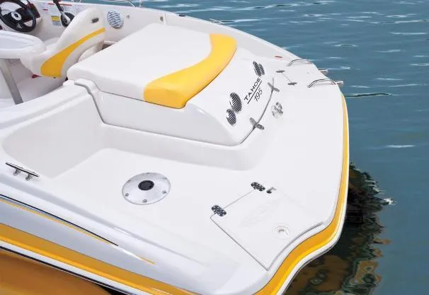 Slide: The Image of 2012 Tahoe 195 boat with yellow accents on water. - 11