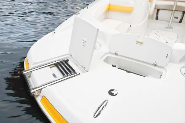 Slide: The Image of 2012 Tahoe 195 boat with swim platform and ladder on calm water. - 13
