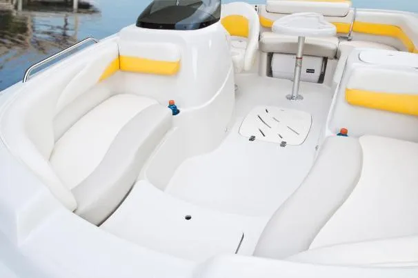 Slide: The Image of Interior of a 2012 Tahoe 195 boat with white and yellow seating. - 16