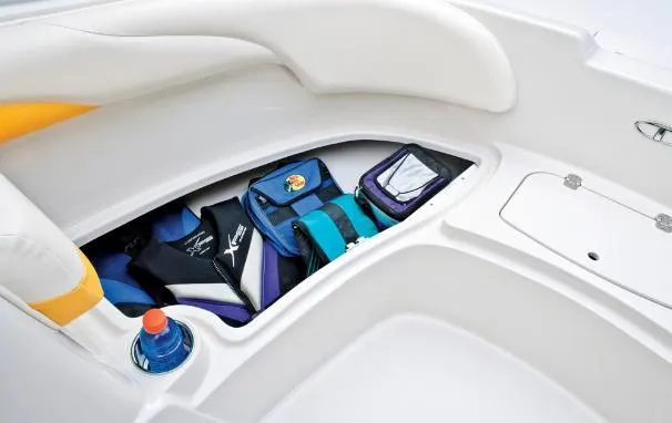 Slide: The Image of Storage compartment in a 2012 Tahoe 195 boat with life jackets and gear. - 18