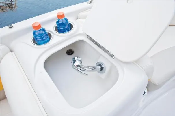 Slide: The Image of Boat sink with faucet and cup holders, featuring two sports drinks. Tahoe 195, 2012 model. - 21