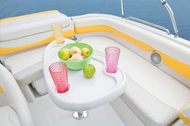 Slide: The Image of Cozy seating area on a 2012 Tahoe 195 boat with fruit and drinks on a table. - 22