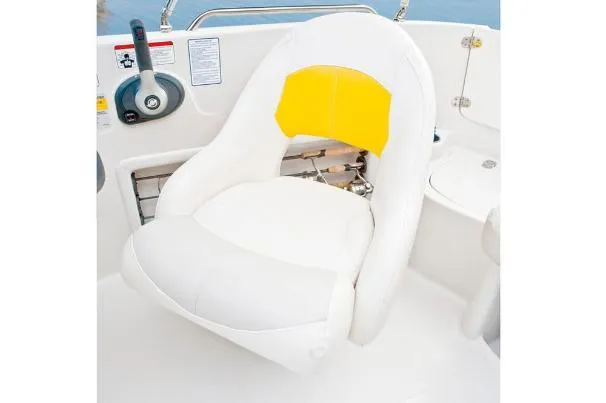 Slide: The Image of White and yellow boat seat in a 2012 Tahoe 195 model. - 27
