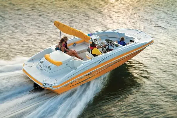 Slide: The Image of 2012 Tahoe 195 boat cruising on water with passengers enjoying the ride. - 3