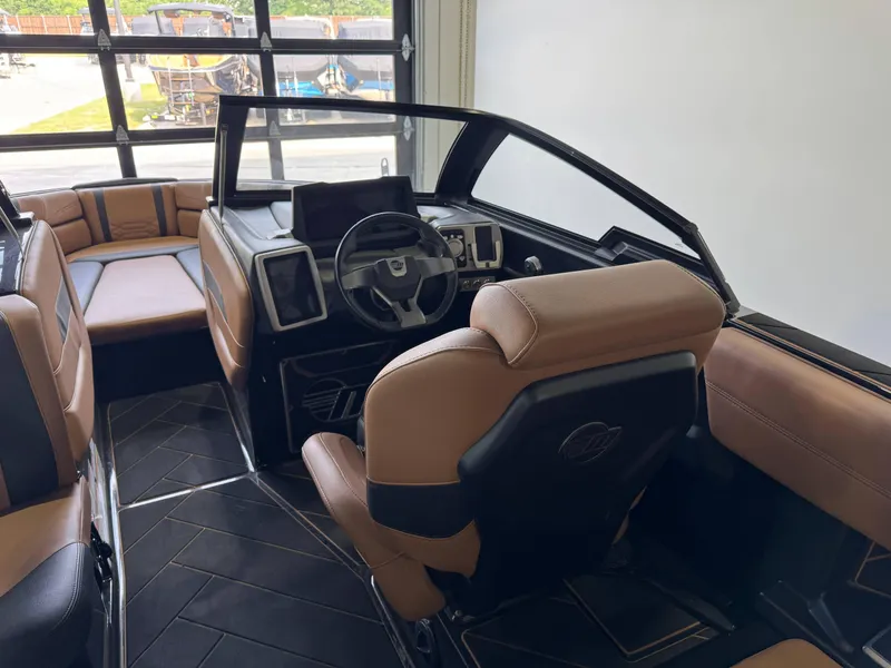 Slide: The Image of 2023 Malibu Wakesetter 26 LSV interior with luxurious seating and modern dashboard design. - 15