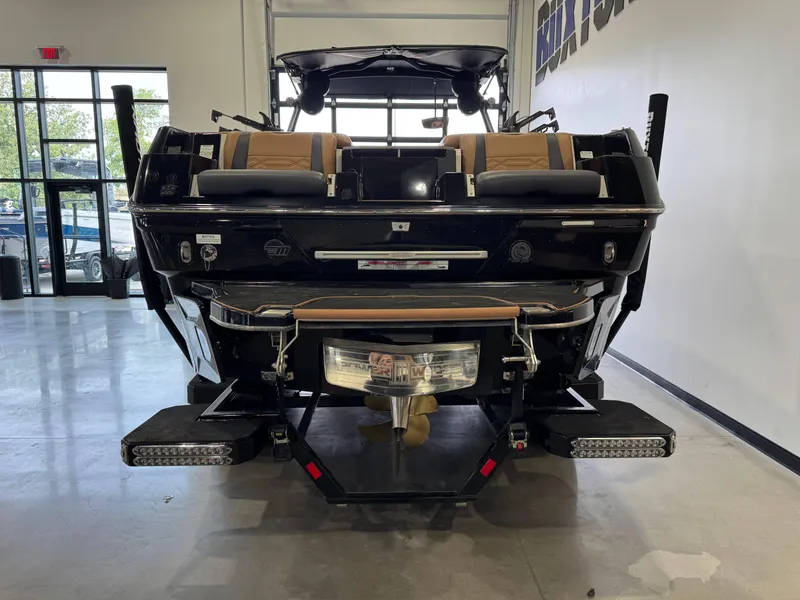 Slide: The Image of 2023 Malibu Wakesetter 26 LSV boat displayed indoors, rear view. - 6