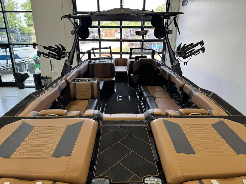 Slide: The Image of 2023 Malibu Wakesetter 26 LSV interior with luxurious seating and modern design. - 8
