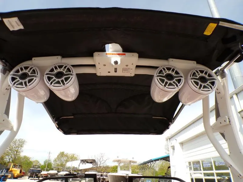 Slide: The Image of 2023 Supra SL 450 boat with mounted speakers under canopy. - 11