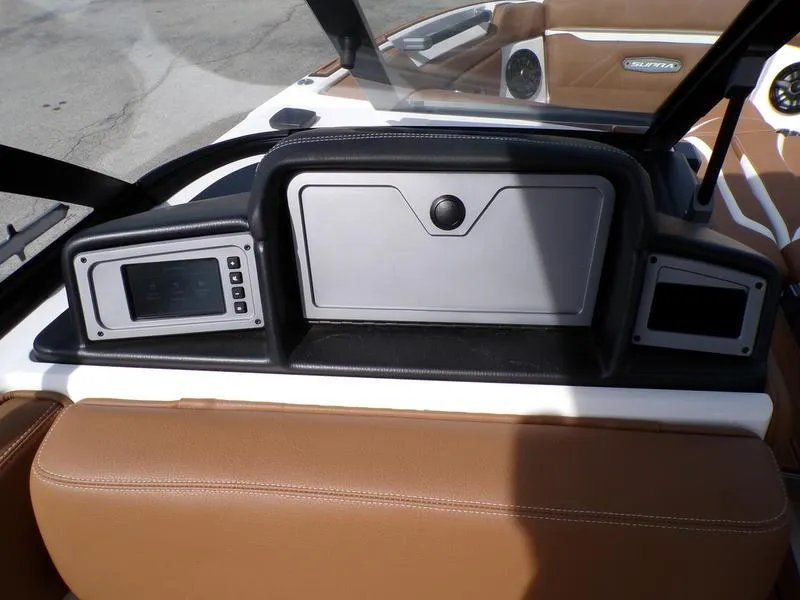 Slide: The Image of 2023 Supra SL 450 dashboard with modern controls and brown leather seating. - 16